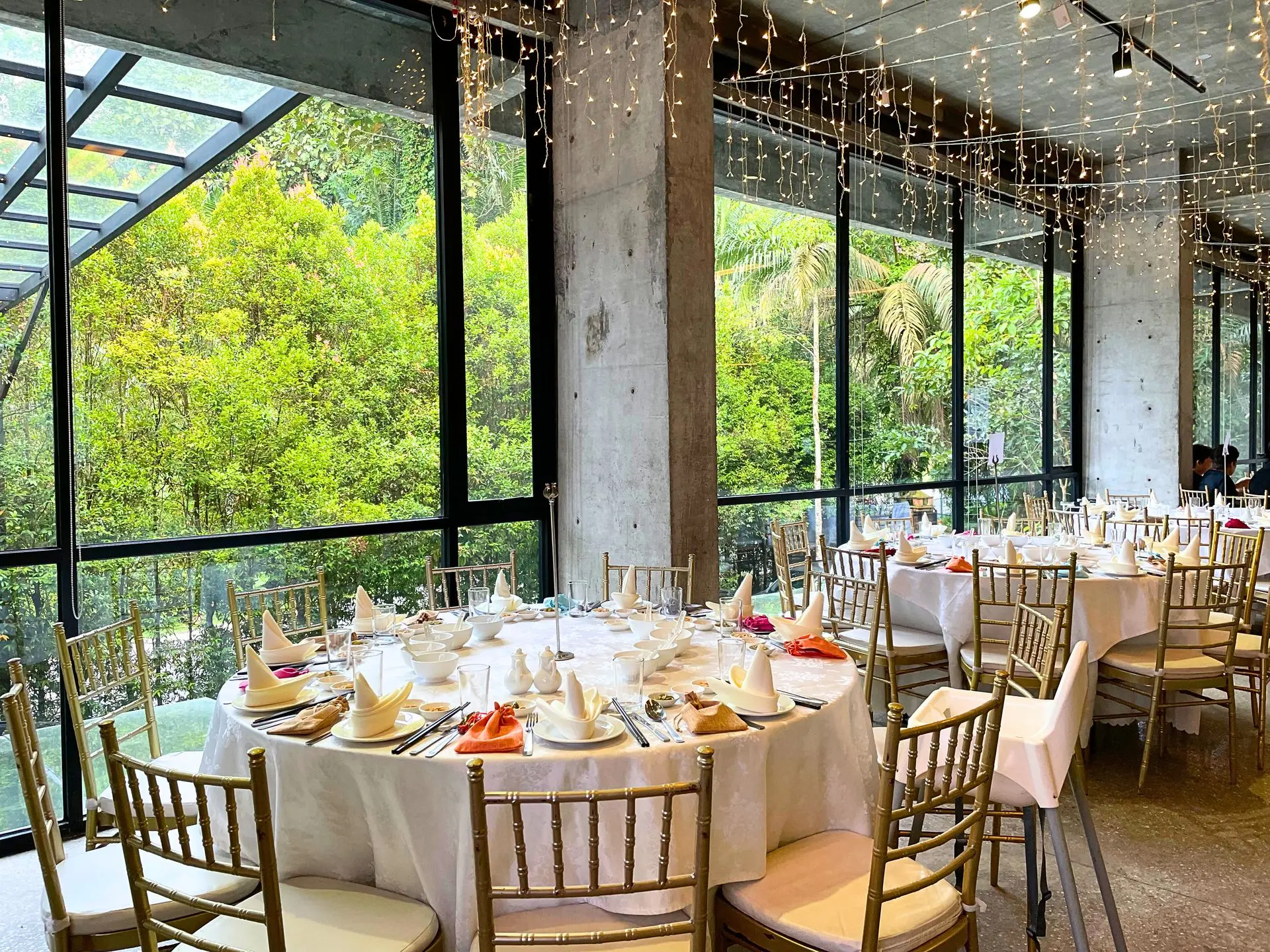 Chinese wedding banquet table setup by large windows with forest view in Selangor by Teaffani Catering